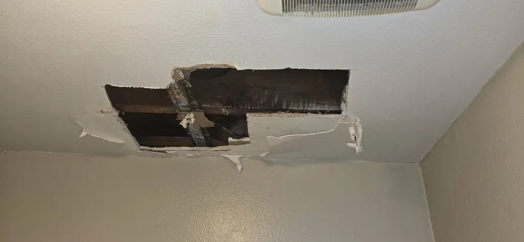 Ceiling drywall repair in progress in San Diego