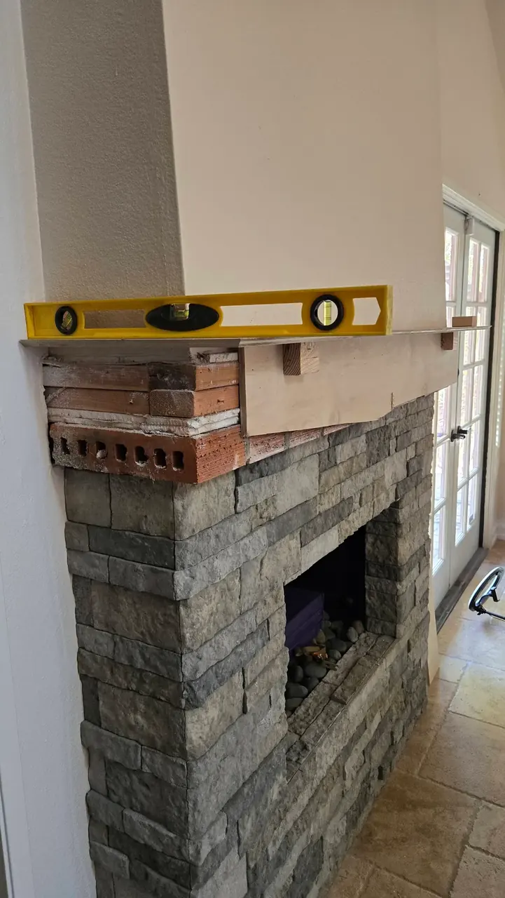 Stacked-stone fireplace and mantel build in San Diego