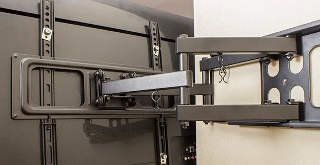 Full-motion TV wall mount bracket installed and extended in a San Diego home